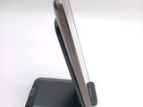 a cell phone that is sitting on top of a stand