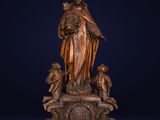 an image of a statue of a woman holding a child