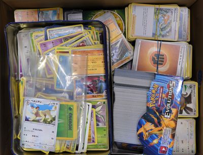 a box full of pokemon cards and cards in it