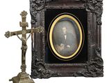a picture of a man holding a cross in front of a cross