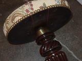 a lamp that is sitting on the floor next to a door