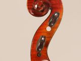 an old violin with a wooden back and a long neck