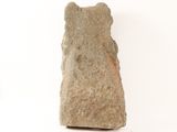 a stone object that is sitting on a white surface