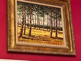 a picture of a painting hanging on a red wall