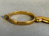 a gold ring that has a hand on it