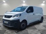 a white van is parked in a room with checkered floor