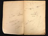 an old book with a bunch of writing on it sitting on a table