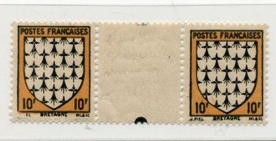 two stamps with a coat of arms on them on a white surface
