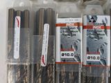 a lot of screws that are in a plastic container