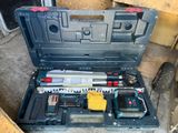 a tool box with tools inside of it on the floor