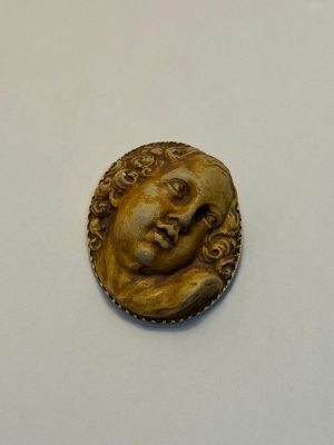 l'image d'une pièce d'or sur laquelle figure le visage d'une femme