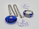 three pieces of jewelry including a necklace, ring, and a bracelet