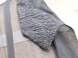 a close up of a shirt with a tie on it
