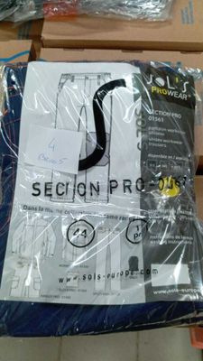 a bag of clothing sitting on top of a wooden table