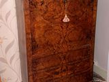 a wooden cabinet with a book on top of it