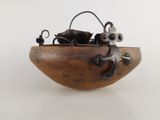 a small wooden bowl with a cat and mouse in it