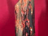 an image of a mannequin wearing a black and red floral shirt