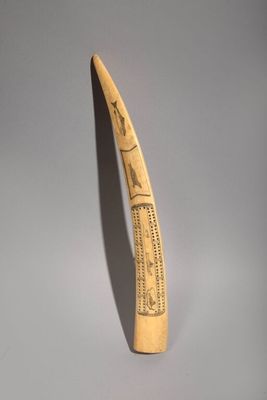 a toothbrush that has been carved with writing on it