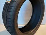 a close up of a tire on a white surface