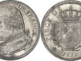 a silver coin with a crown on top of it