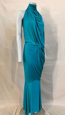 a mannequin dress with a draped neckline and a long skirt