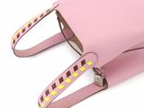 the small pink bag has a yellow and brown checkered pattern on it