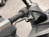 a close up of a motorcycle with a black handlebar