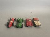 several toy cars are lined up in a row on a table