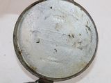 a small frying pan with a handle on a table