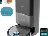 a close up of a blue and black vacuum cleaner and a phone