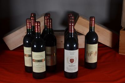 several bottles of wine are lined up on a red table cloth