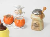 a small group of ceramic figurines that are on a table
