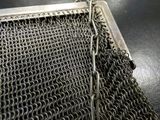 a close up of a chain mail bag on a table