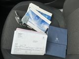 a blue wallet sitting on the seat of a car