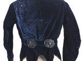 a close up of a blue velvet jacket on a mannequin mannequin