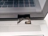 a small screw that has been inserted into the keyboard of a laptop