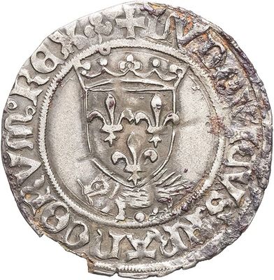 a close up of a coin with a coat of arms on it