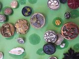 a lot of buttons that are on a green surface