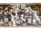 a picture of a black and white screen with birds and flowers