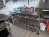 a large stainless steel kitchen with lots of counter space