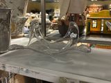 a glass vase on a shelf in a store