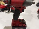 an image of a cordless drill is on a table in a warehouse