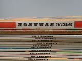 several books stacked on top of each other on a table