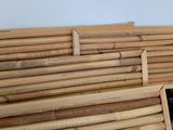 a pile of bamboo boards stacked on top of each other