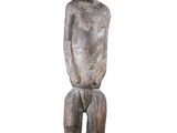 an image of a wooden statue of a man sitting on a black base