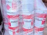 boxes of milk are stacked on top of a pallet in a warehouse