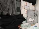 a pile of clothes that is sitting on a table