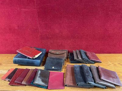 many different types of leather wallets on a table