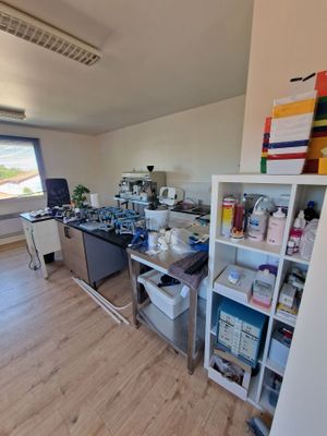 an image of a kitchen with a lot of clutter on the floor