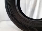 a close up of a tire on a white surface